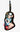 A black PVC luggage tag with a colorful illustration of a cartoon woman in a sailor outfit, sitting next to a decorative ceramic piece.