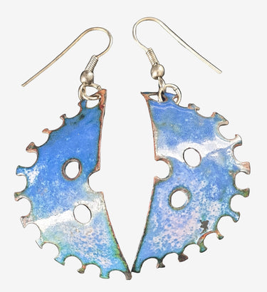 A pair of blue enamelled crescent-shaped vintage earrings with a crimped edge design, displayed against a black background.