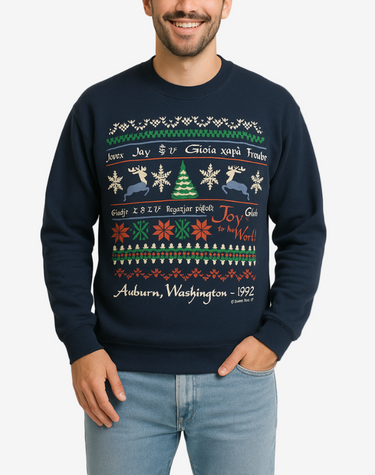 Man wearing a navy blue Christmas sweater with colorful patterns and text on a beige background