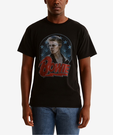 Person wearing a black t-shirt with a graphic design on a plain background