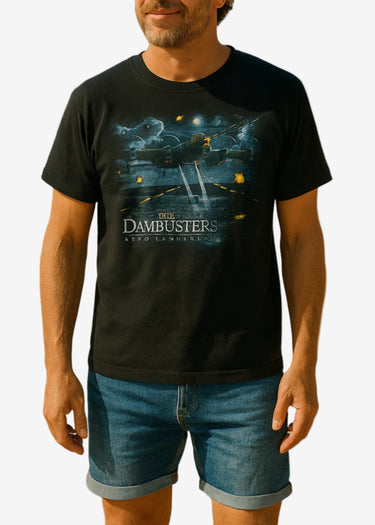 Man wearing a black t-shirt with 'The Dambusters' design on a white background