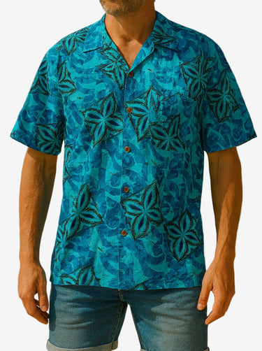 Man wearing a blue patterned shirt on a white background