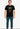 Man wearing a black t-shirt with text on a white background