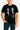 Person wearing a black t-shirt with a graphic design of two people and 'The X-Files' logo.