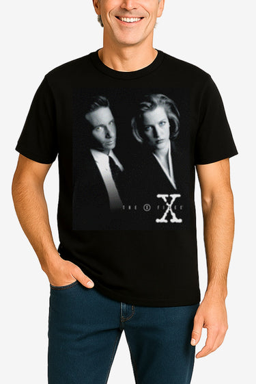 Person wearing a black t-shirt with a graphic design of two people and 'The X-Files' logo.
