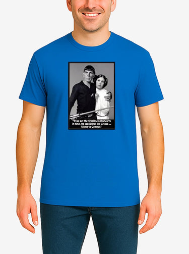 Person wearing a blue t-shirt with a graphic design on a plain background