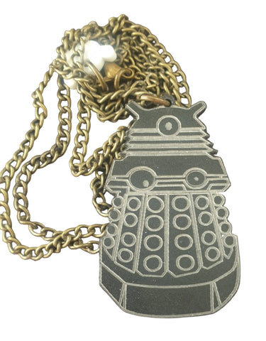Gold chain necklace with a pendant on a white surface