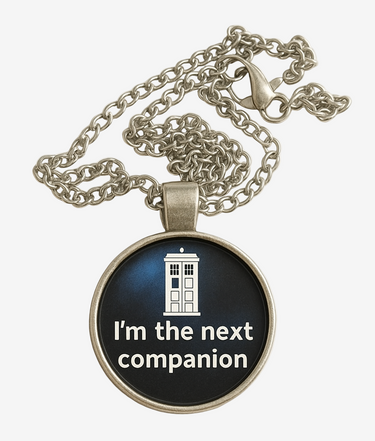 Necklace with pendant featuring TARDIS and text 'I'm the next companion' on a white background