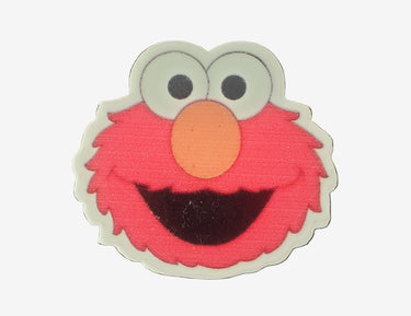Cartoon character face patch with red, white, and orange colors on a white background.