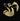 Gold pendant on a chain against a dark background