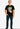 Man wearing a black t-shirt with a graphic design on a white background