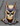 Colorful bat mask with a superhero design on a textured gray background