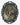 Decorative brooch with gold skeleton design on a black background