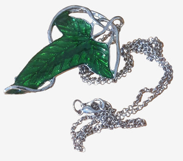 A green elven leaf necklace from The Lord of the Rings, displayed against a white background.