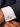 Cufflink with a Mickey Mouse design on a white cuff against a dark suit background