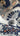 Close-up of a patterned fabric with white, black, and orange design on a blue background