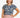 Woman wearing a blue patterned top against a plain background