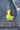 Cartoon character with green elf hat and pants on a denim jacket