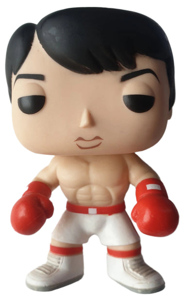 A Funko Pop vinyl figure of Rocky Balboa, featuring a stylized depiction of the character in a fighting stance with red boxing gloves and white shorts. Planet Retro NZ
