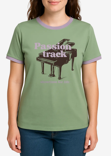 Person wearing a green t-shirt with a piano graphic and text on a plain background