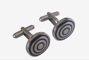 Cufflinks with circular design on a white background