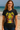 Woman wearing a black t-shirt with a colorful graphic design on a beach