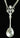 Silver spoon pendant on a chain against a black background