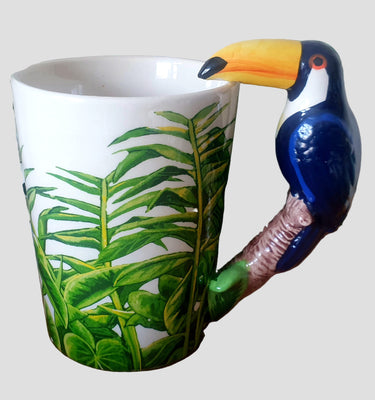 Mug with toucan bird handle and leaf design. Planet Retro NZ