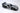 Silver toy Porsche car on a white background