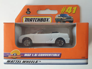 Matchbox toy car packaging with a white convertible car inside on an orange background.