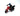 Toy figure of a person on a red motorcycle against a white background