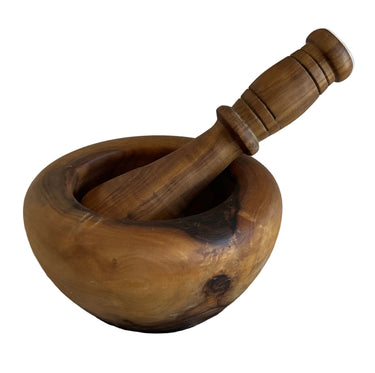 Wooden mortar and pestle on a white background