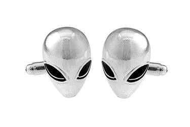 Silver alien head cufflinks on a white background