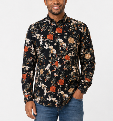 Black floral long sleeved mens shirt with rust, cream and beige rose print, shown on a male model with jeans.