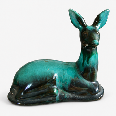 Vintage Blue Mountain Pottery reclining deer in green and black reflow glaze.