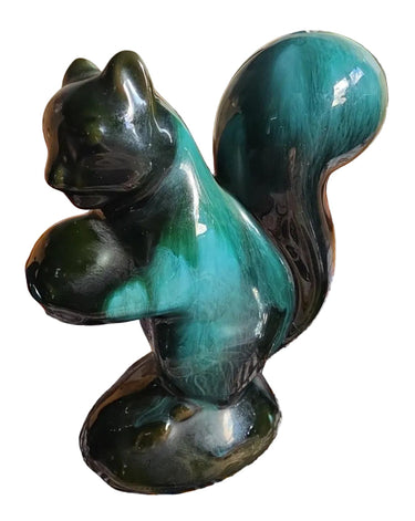 Vintage Blue Mountain Pottery squirrel figurine in teal green and black glaze, catalog view