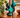Vintage Blue Mountain Pottery squirrel figurine with teal and green drip glaze displayed on a mid-century wooden sideboard
