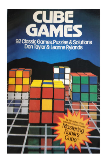 Book cover of 'Cube Games' with Rubik's Cube images on a blue background