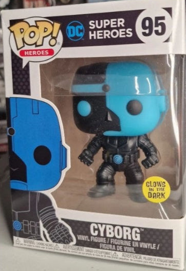 A Funko Pop vinyl figure of Cyborg from DC's Super Heroes set, glow-in-the-dark variant, packaged in a window display box. Planet Retro NZ