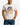 Man wearing a white t-shirt with a colorful graphic design on a plain background