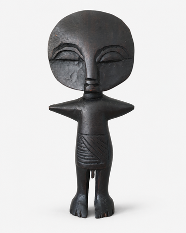 Ghana Akuaba-style wooden fertility figure, dark carved wooden sculpture with rounded head and stylised body.