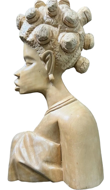 Hand-carved African-style female wall sculpture front view