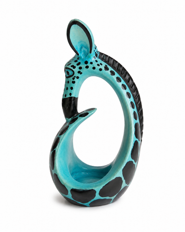 Hand carved turquoise soapstone giraffe tealight holder sculpture.