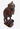 A hand-carved dark wood monkey figurine standing on a small base, photographed against a plain white background.