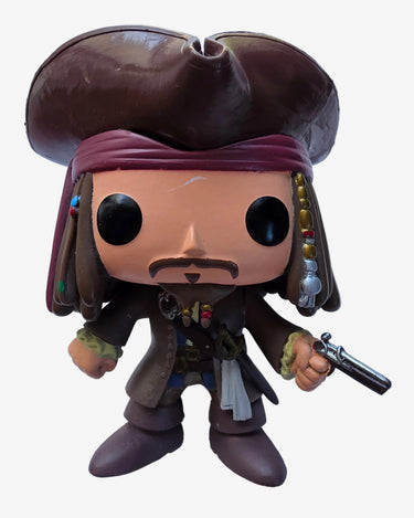 A Jack Sparrow Funko Pop! vinyl figure holding a pistol, standing on a white surface.