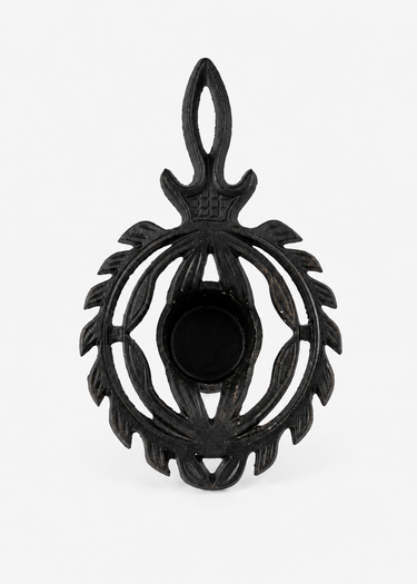 Vintage Japanese cast iron thistle tealight stand with black finish and decorative openwork design.