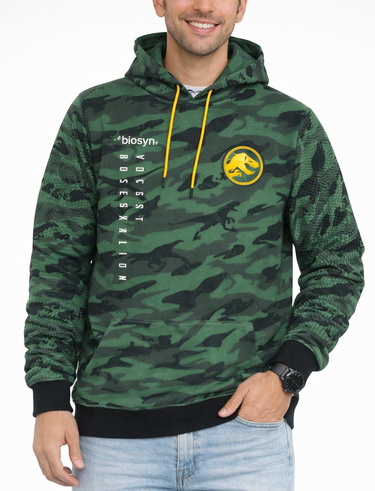 Person wearing a green camouflage hoodie with a logo, standing against a white background