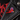 Killstar SheDevil red devil enamel pin with purple hair and Hexes Spells book on a black leather jacket lapel