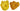 Two yellow silicone mold shapes on a white background