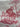 Close-up of wine-red skeleton toile fabric showing seated Georgian figure and pitcher